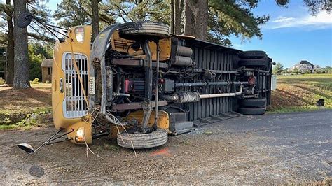 Virginia school bus driver and 12 children hurt after bus overturns, officials say